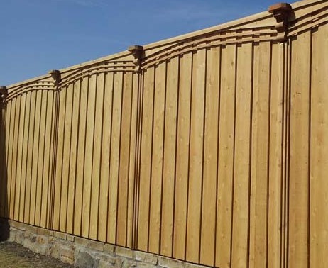 wood fence with retaining wall